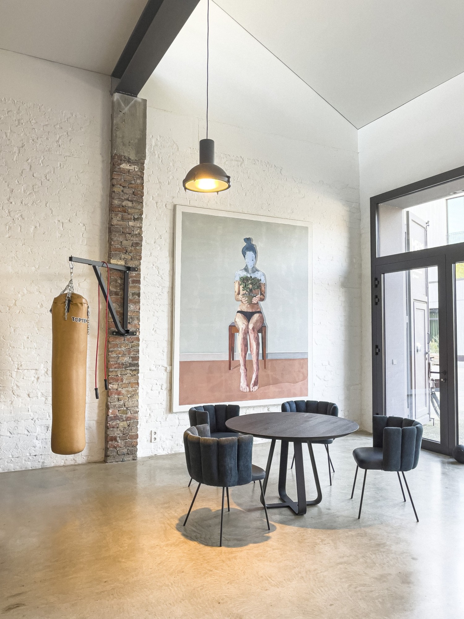 Black Gaia chairs KFF around Axis round table ASCO in front of large mural