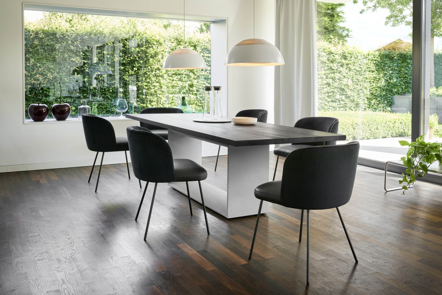 Black Gaia Line chairs KFF at Frame dining table with concrete base by ASCO