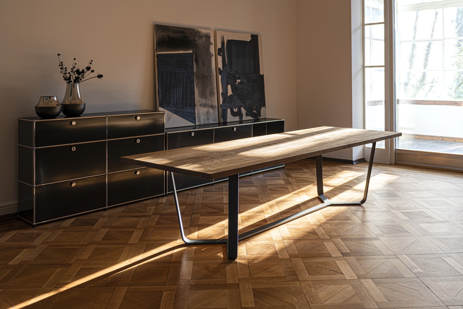 Axis ASCO dining table in an old building with sunlight