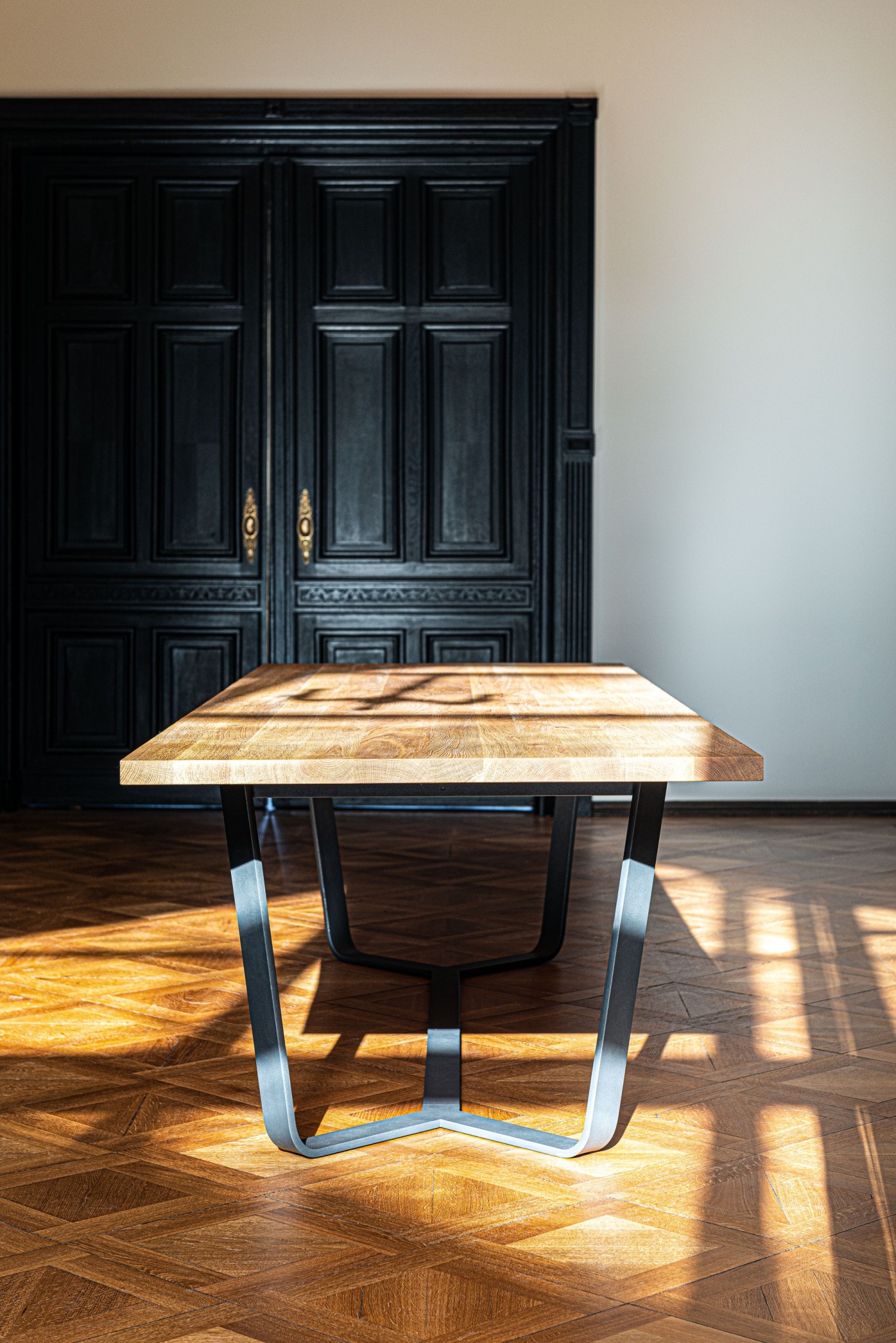 Axis ASCO dining table in an old building with sunlight