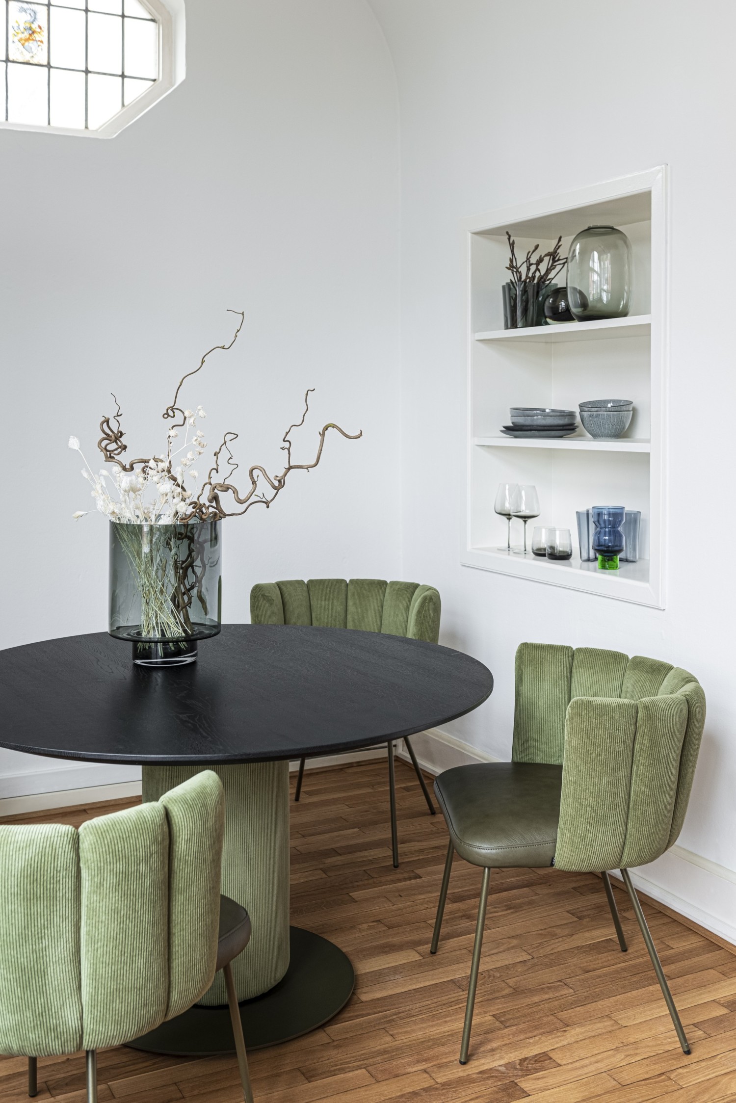 Green Gaia chairs KFF around Gaia round dining table with black wooden top ASCO