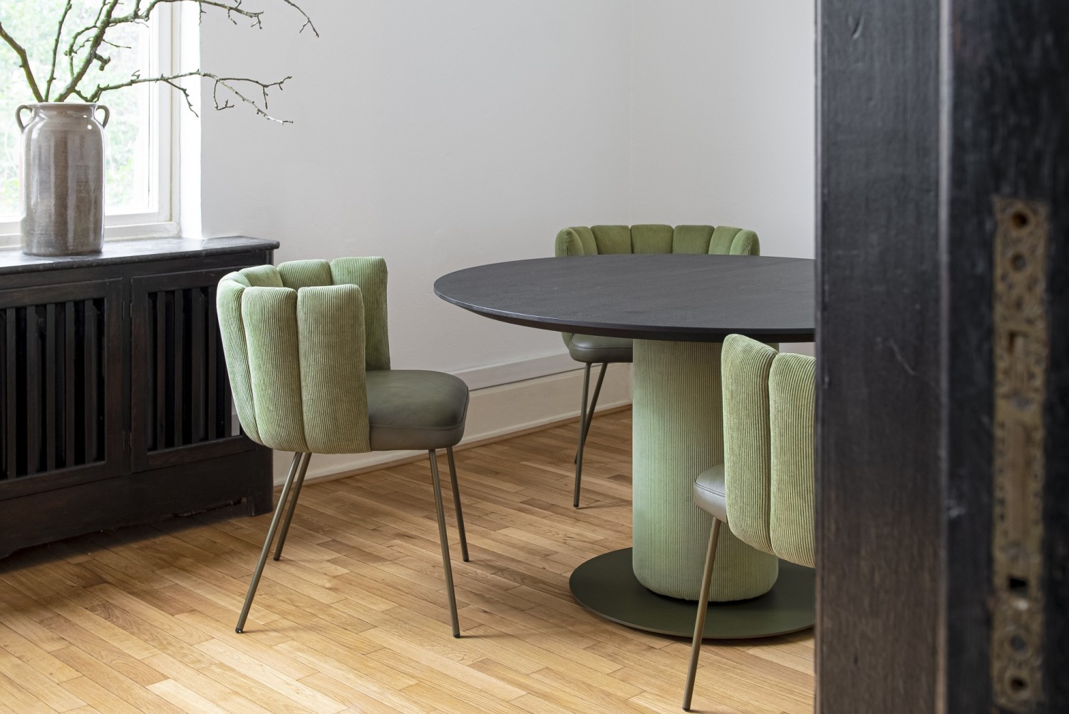 Green Gaia chairs KFF around Gaia round dining table with black wooden top ASCO