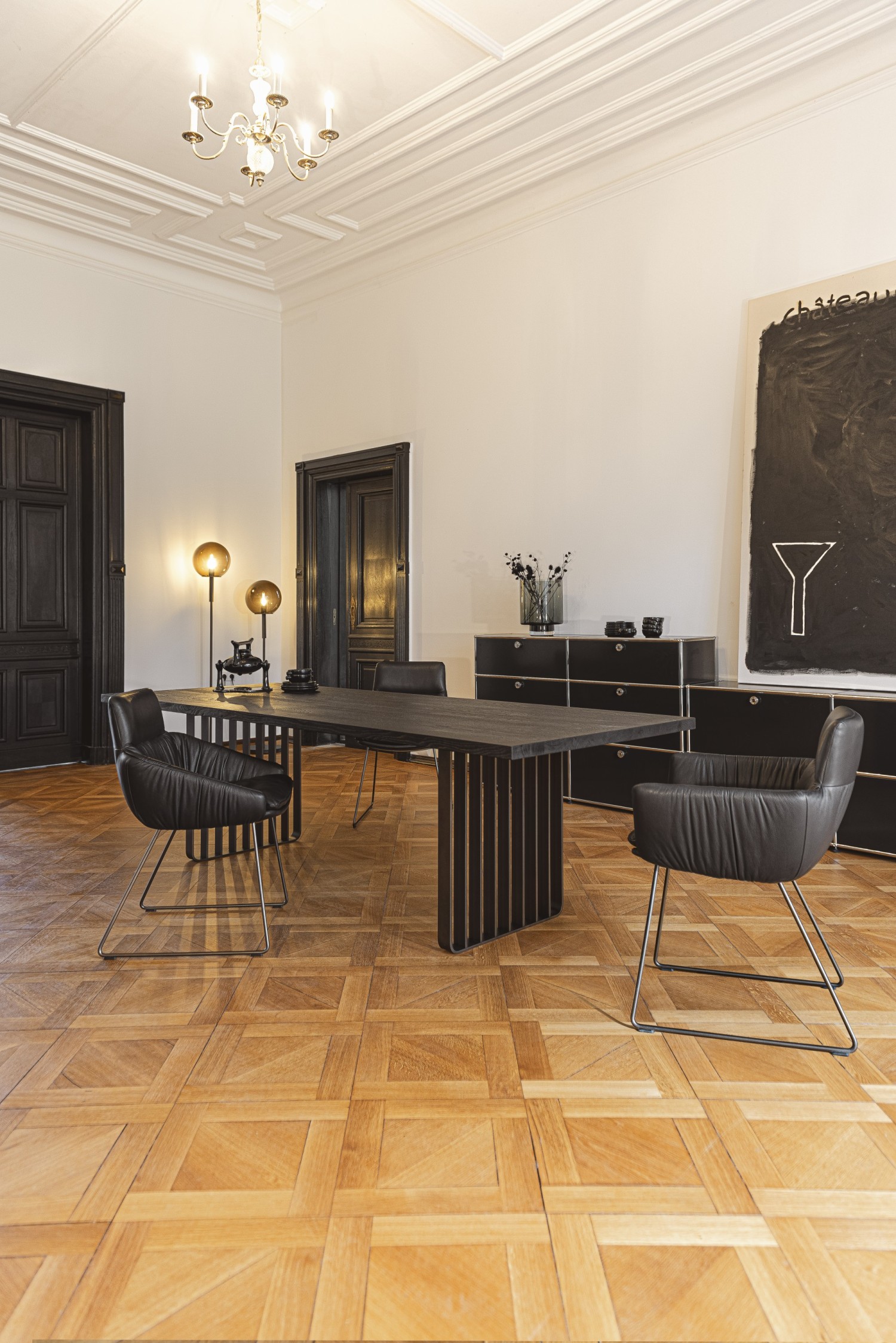 Black Faye chairs KFF at black Lamello table ASCO in old building