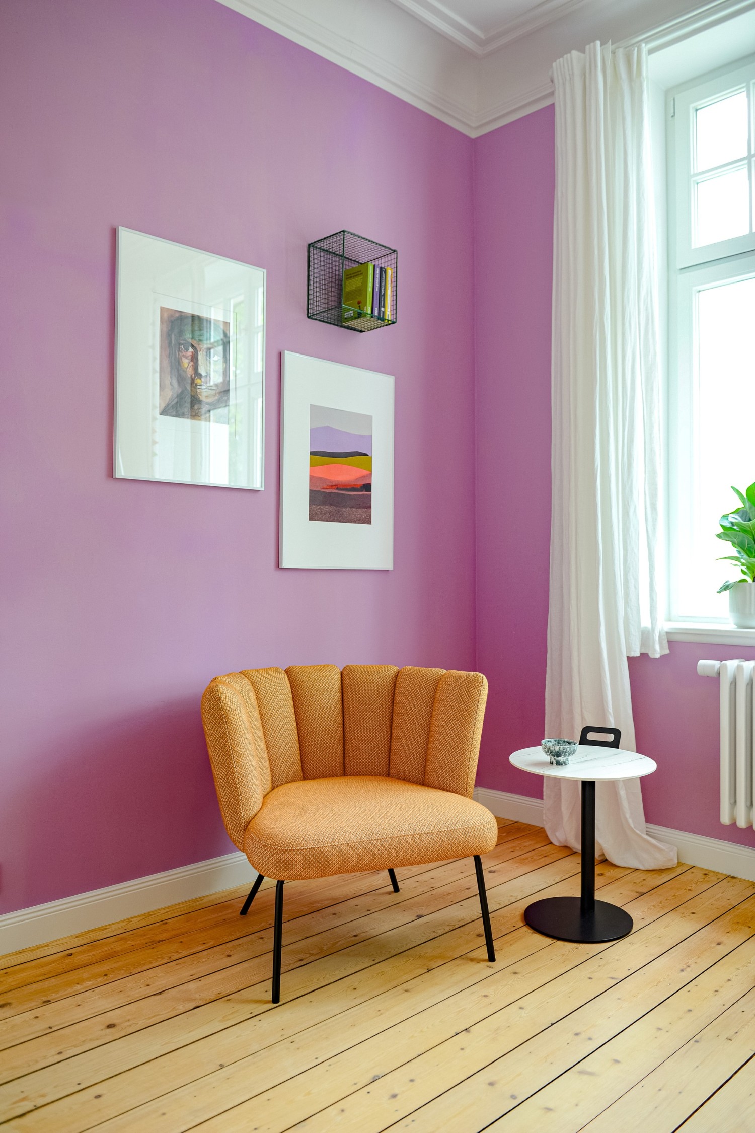 Yellow KFF Gaia lounge chair in front of a purple wall