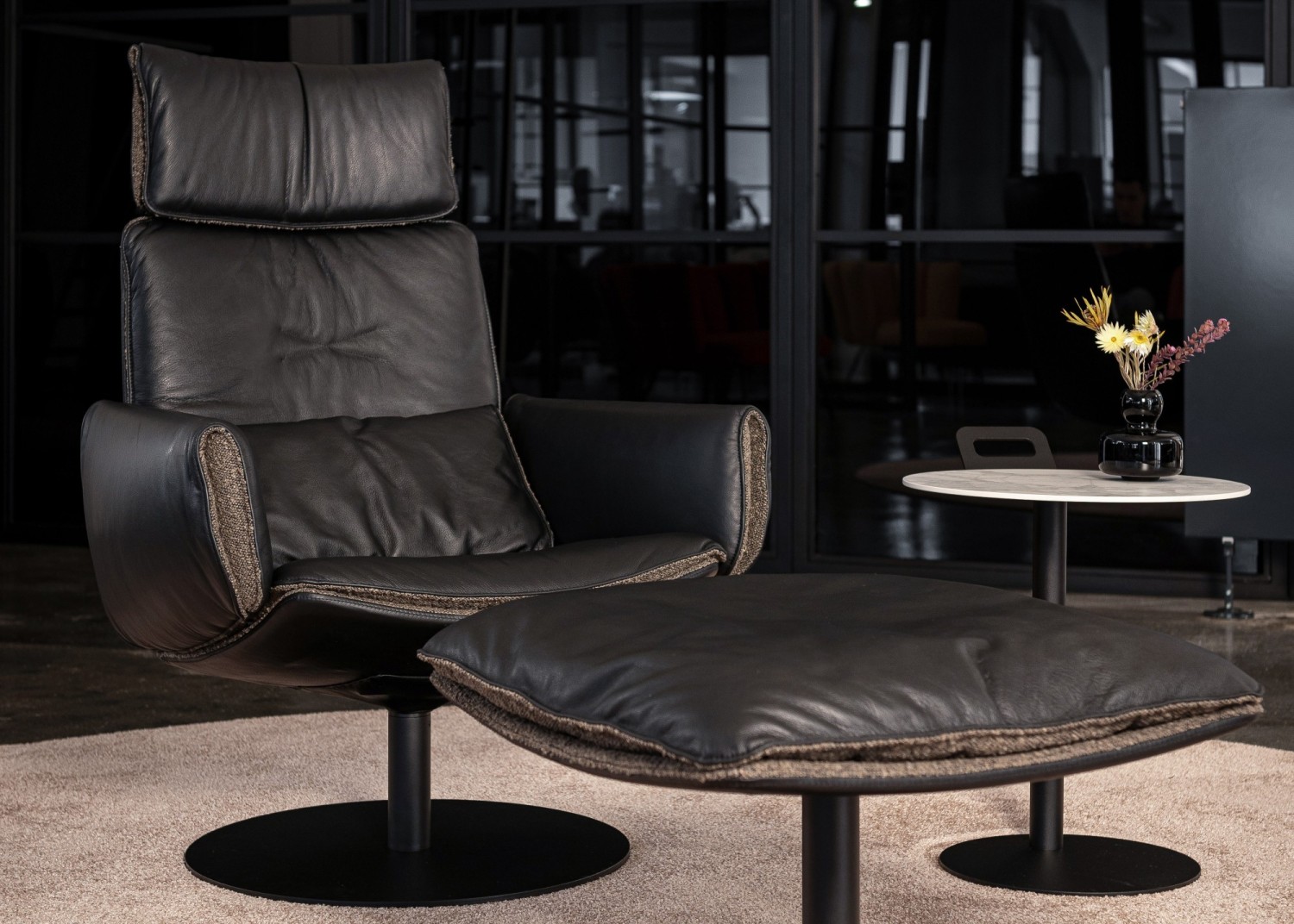 CADO LOUNGE Edition armchair and ottoman in black leather with ASCO Disc side table